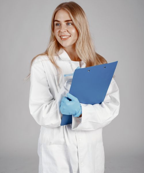 Portrait of woman in white robe Doctor . Isolated over white background